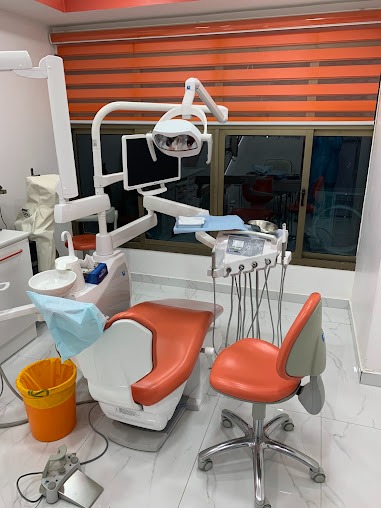 Treatment room with orange dental chair