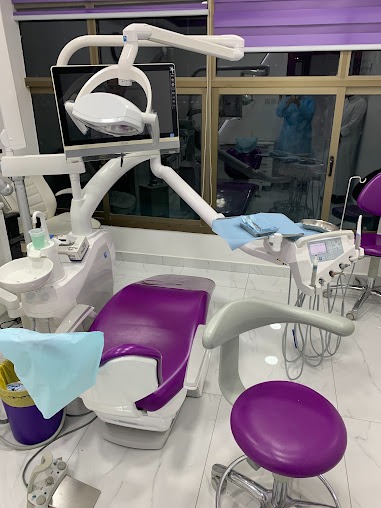 Treatment room with purple dental chair